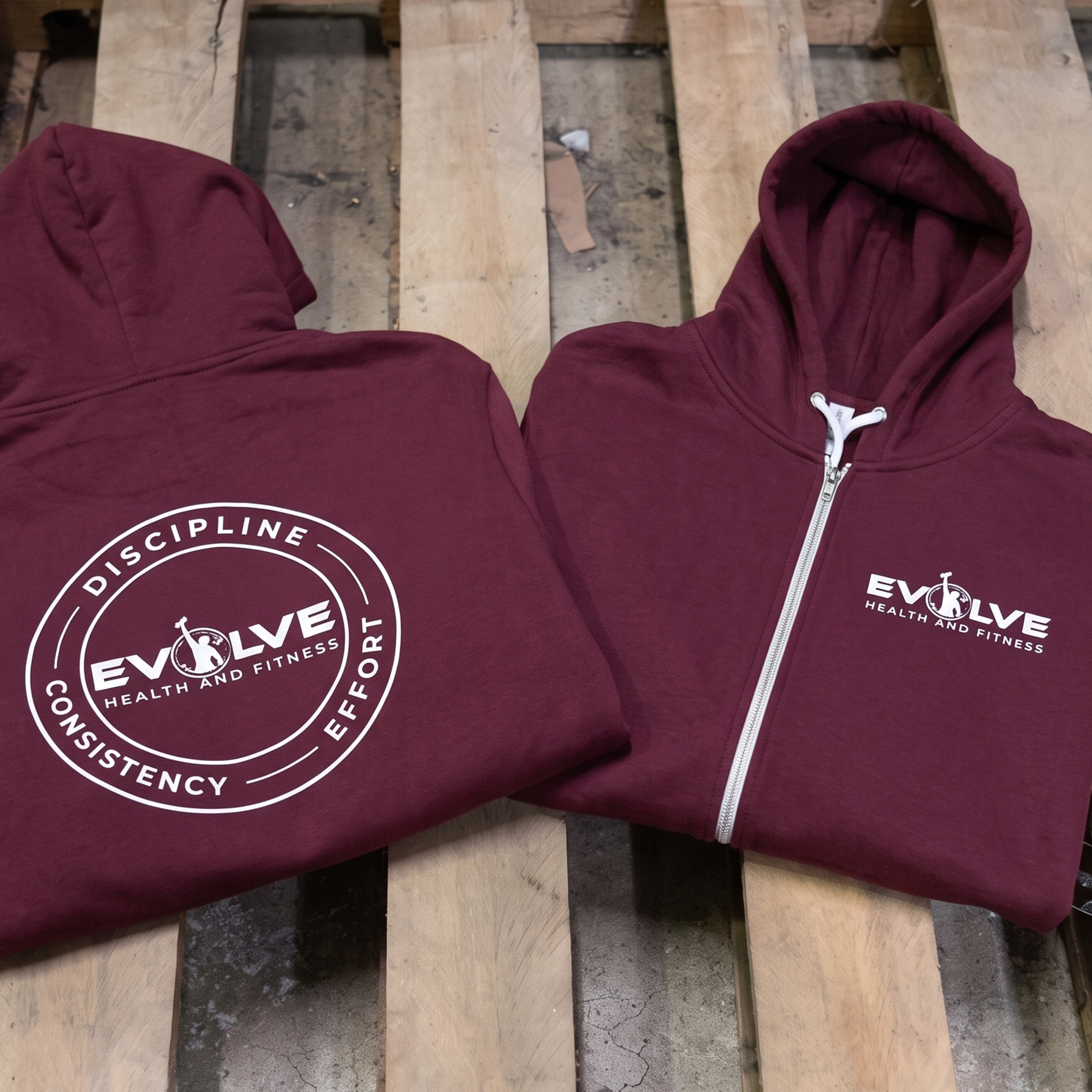 Burgundy zip hoodies with white Evolve chest logo and circular back print.