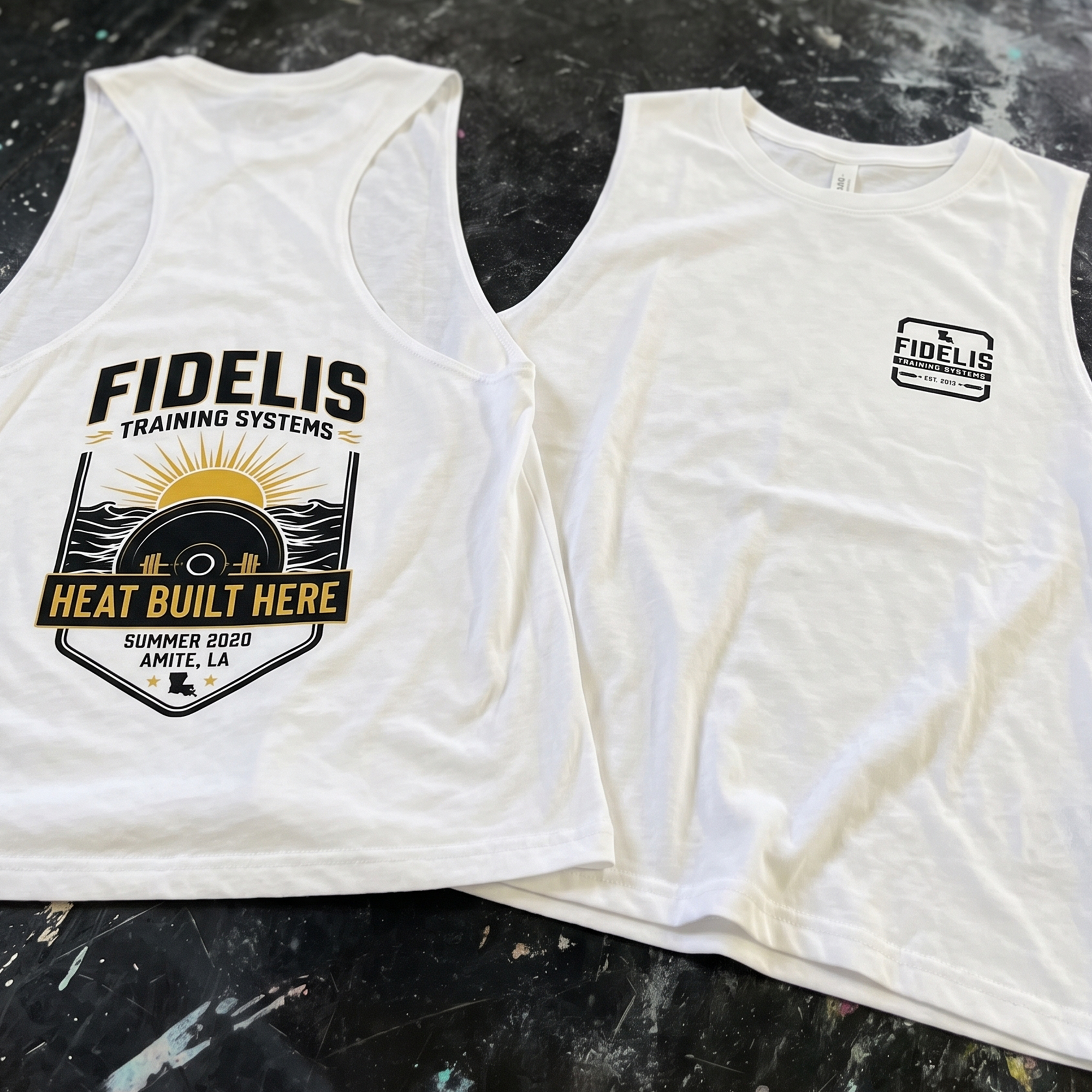 White racerback tank and cropped tee with Heat Built Here and Fidelis prints.