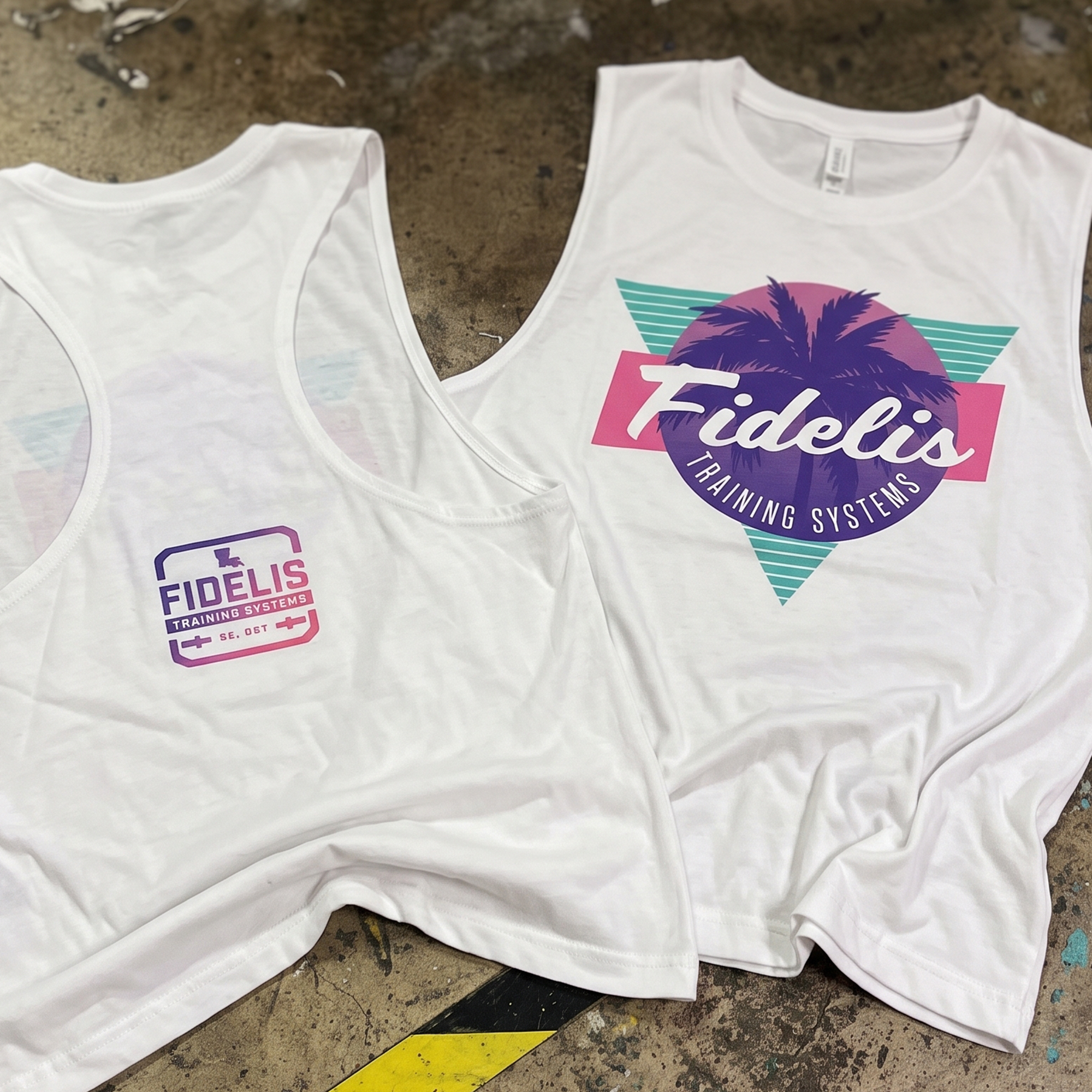 White tank and cropped tee with pink, teal and purple palm tree Fidelis graphics.