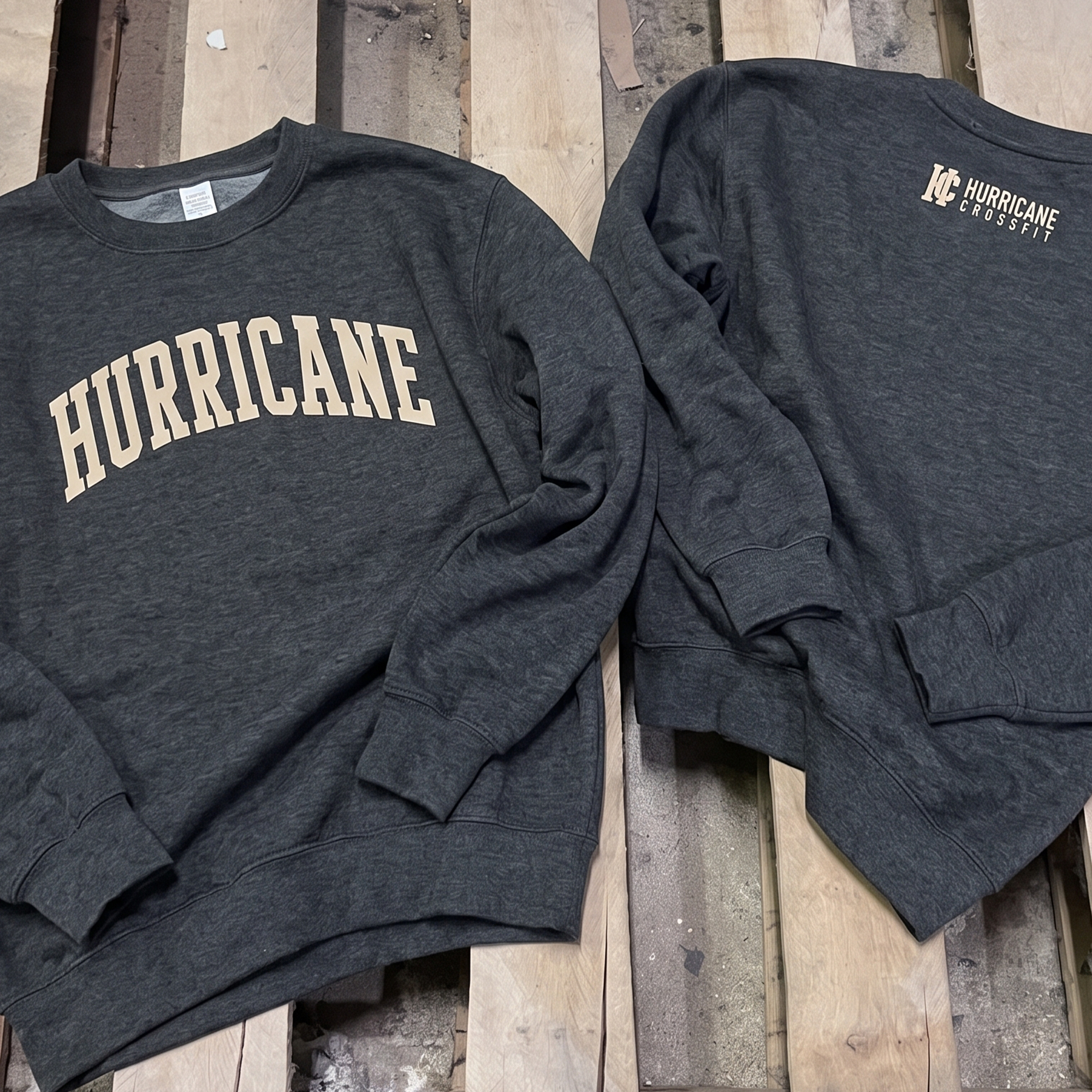 Charcoal sweatshirts with cream Hurricane and Hurricane CrossFit prints.