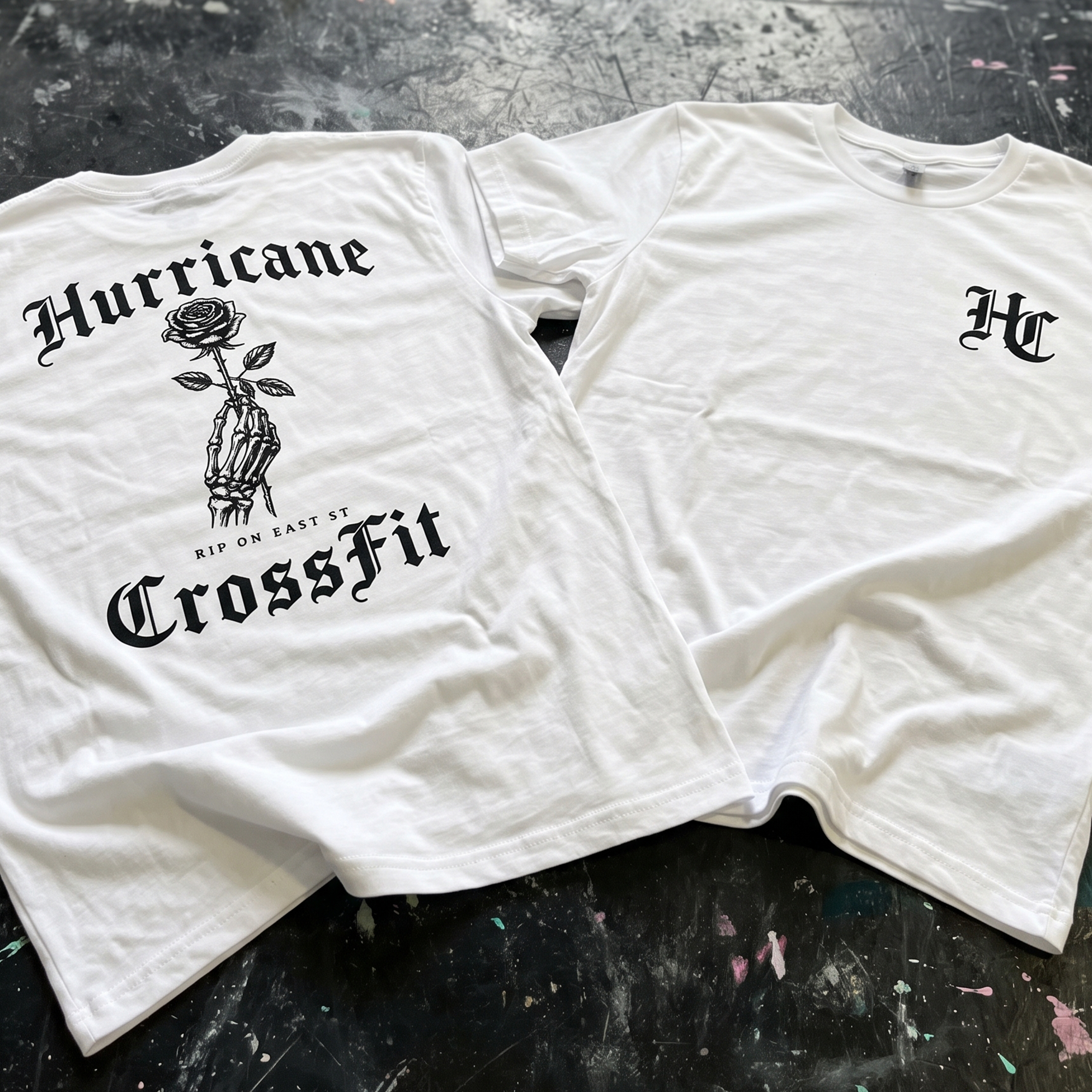 White Hurricane CrossFit tees with black gothic rose and skeleton-hand graphic plus HC chest mark.