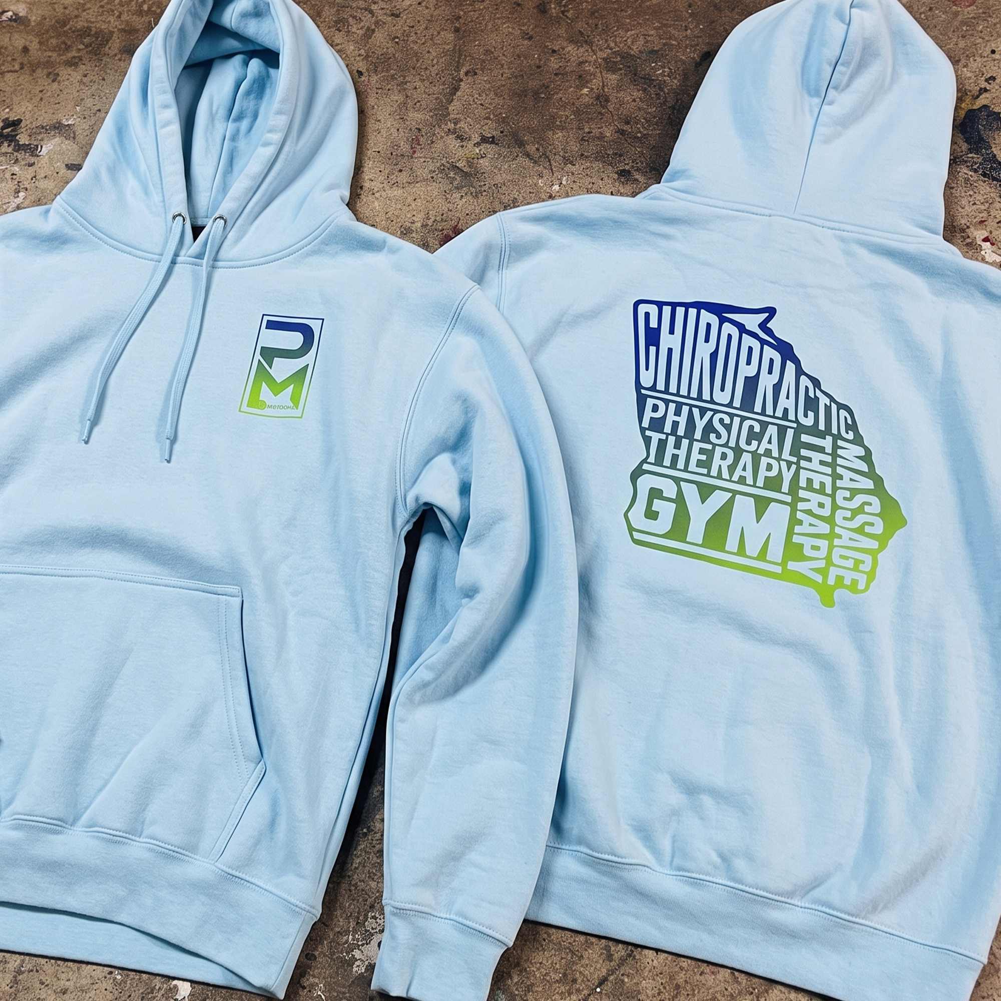 Light blue hoodies with gradient PM Health chest logos and large stacked back graphics.