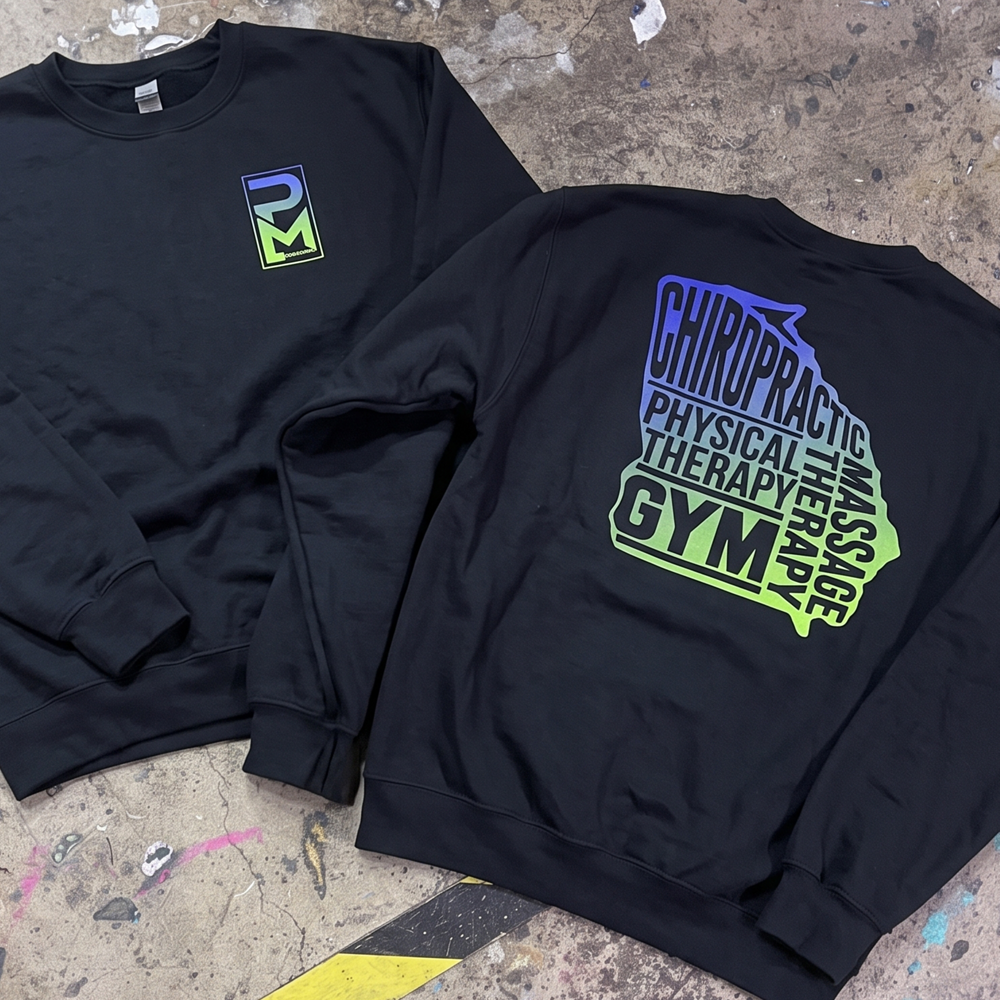 Black crewneck sweatshirts with gradient PM Health chest logos and large stacked back graphics.