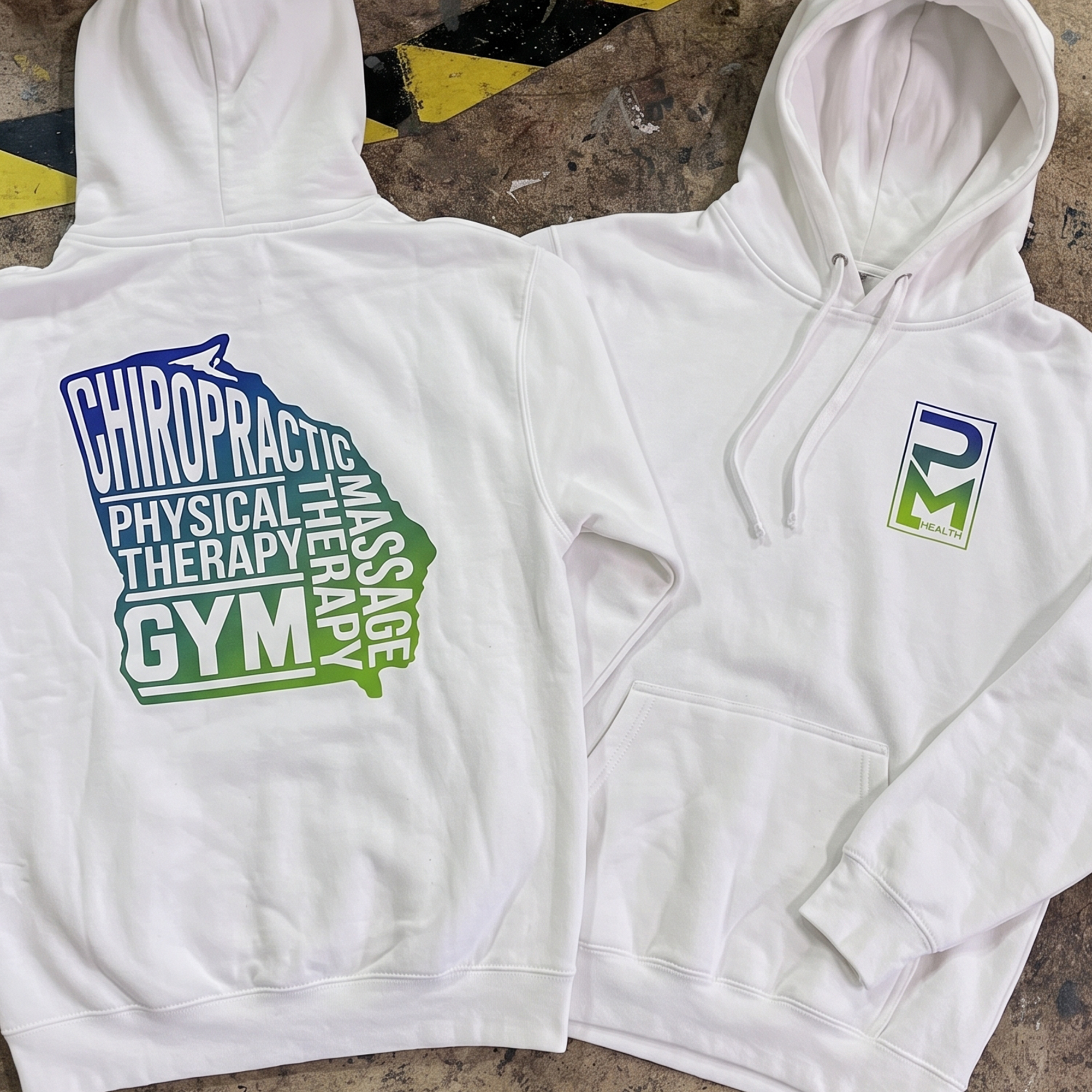 White hoodies with gradient PM Health chest logos and large chiropractic, physical therapy, massage, and gym back prints.