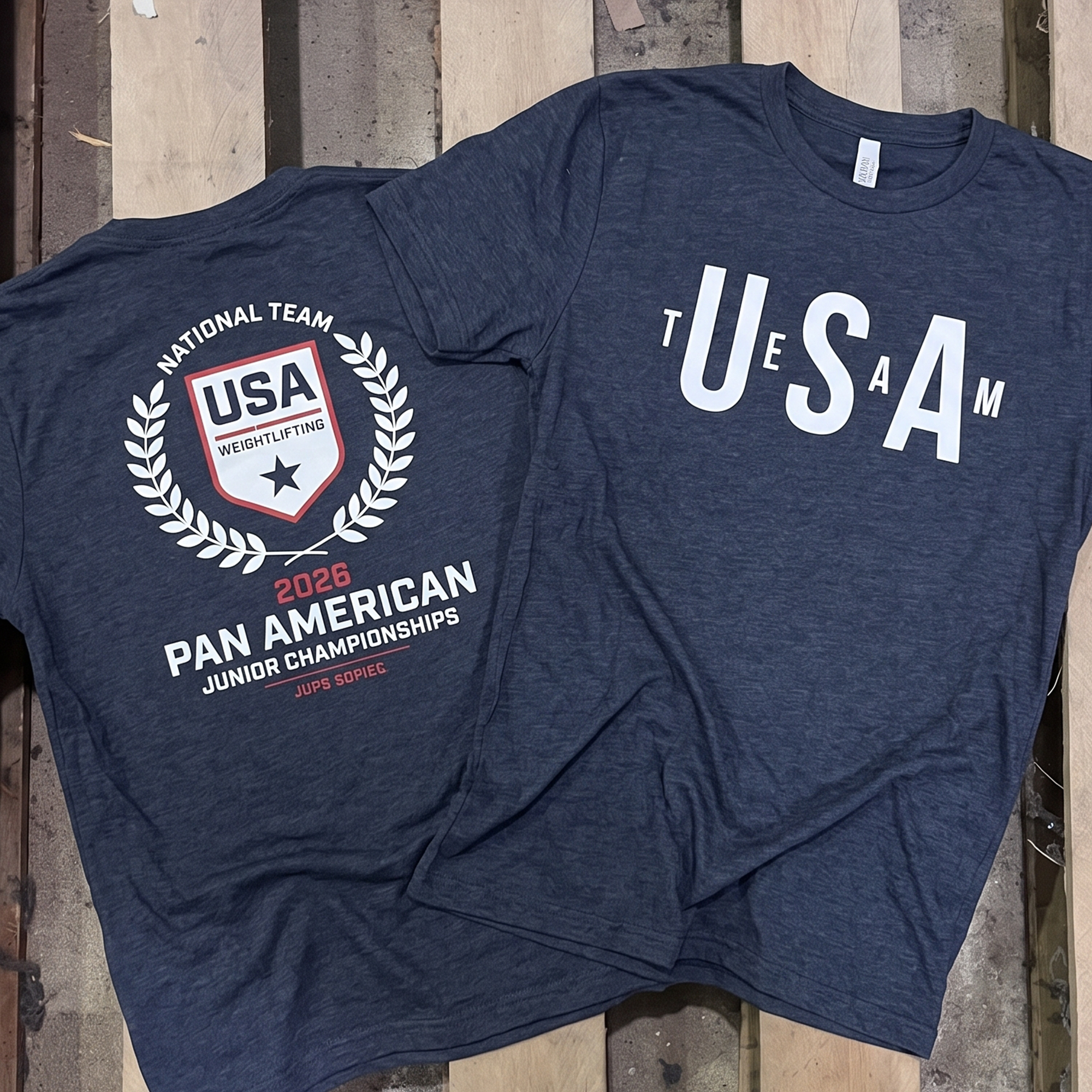 Heather navy SRC Fit fundraiser tee with USA front print and Pan American Junior Championships back crest.