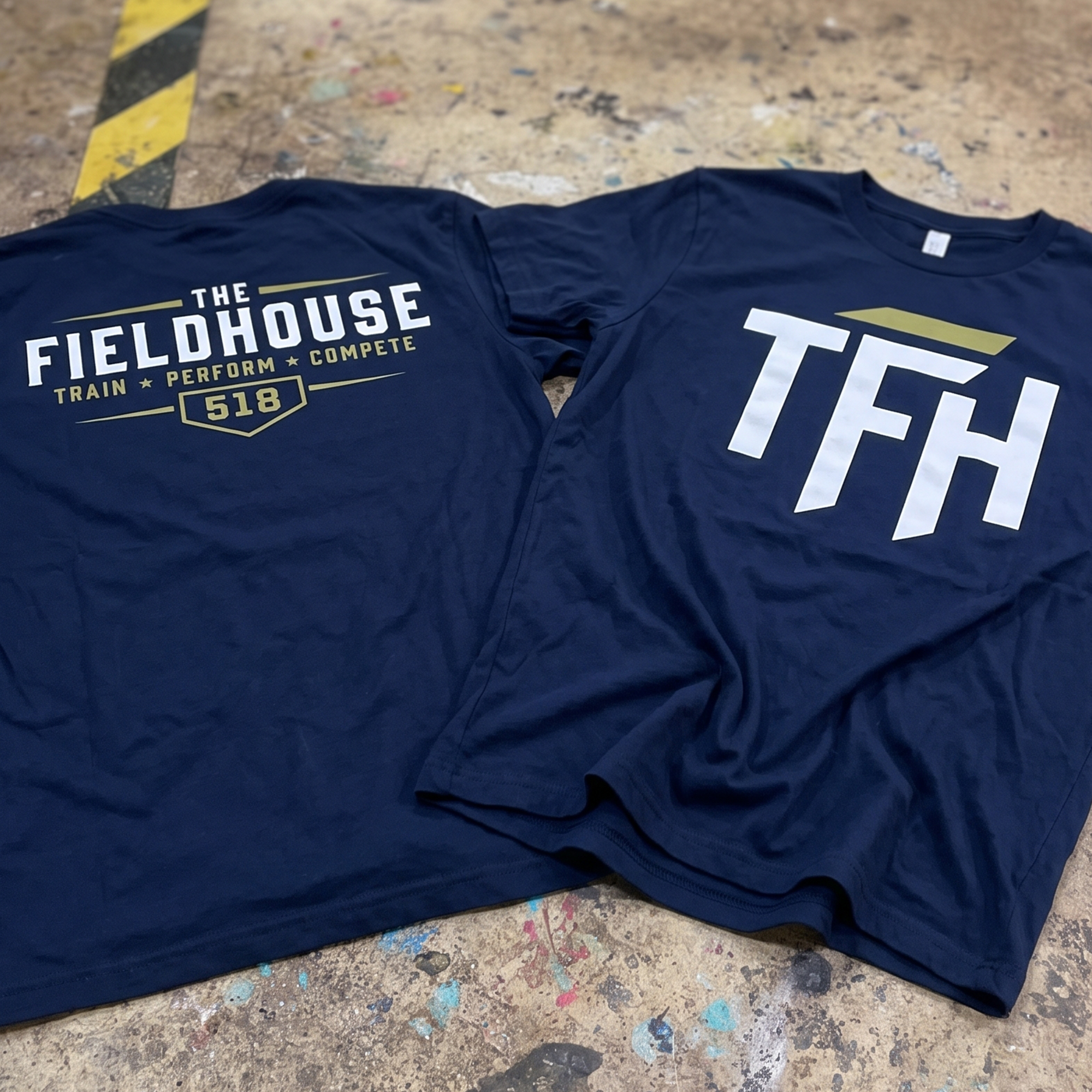 Navy tees with Field House 518 back graphic and large TFH chest print.