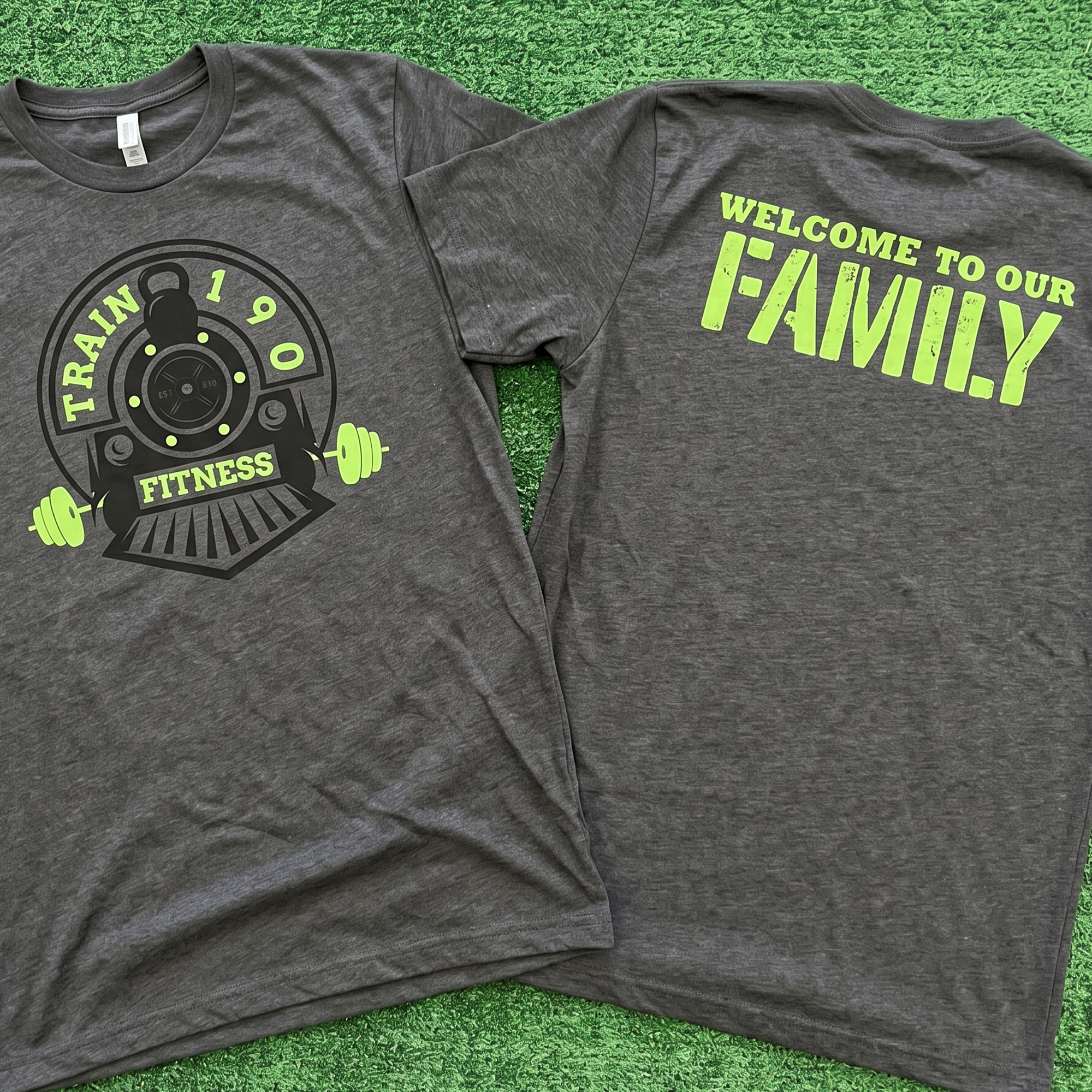 Charcoal Train 190 Fitness tee with lime green weightlifting graphic on front and Welcome to Our Family back print.