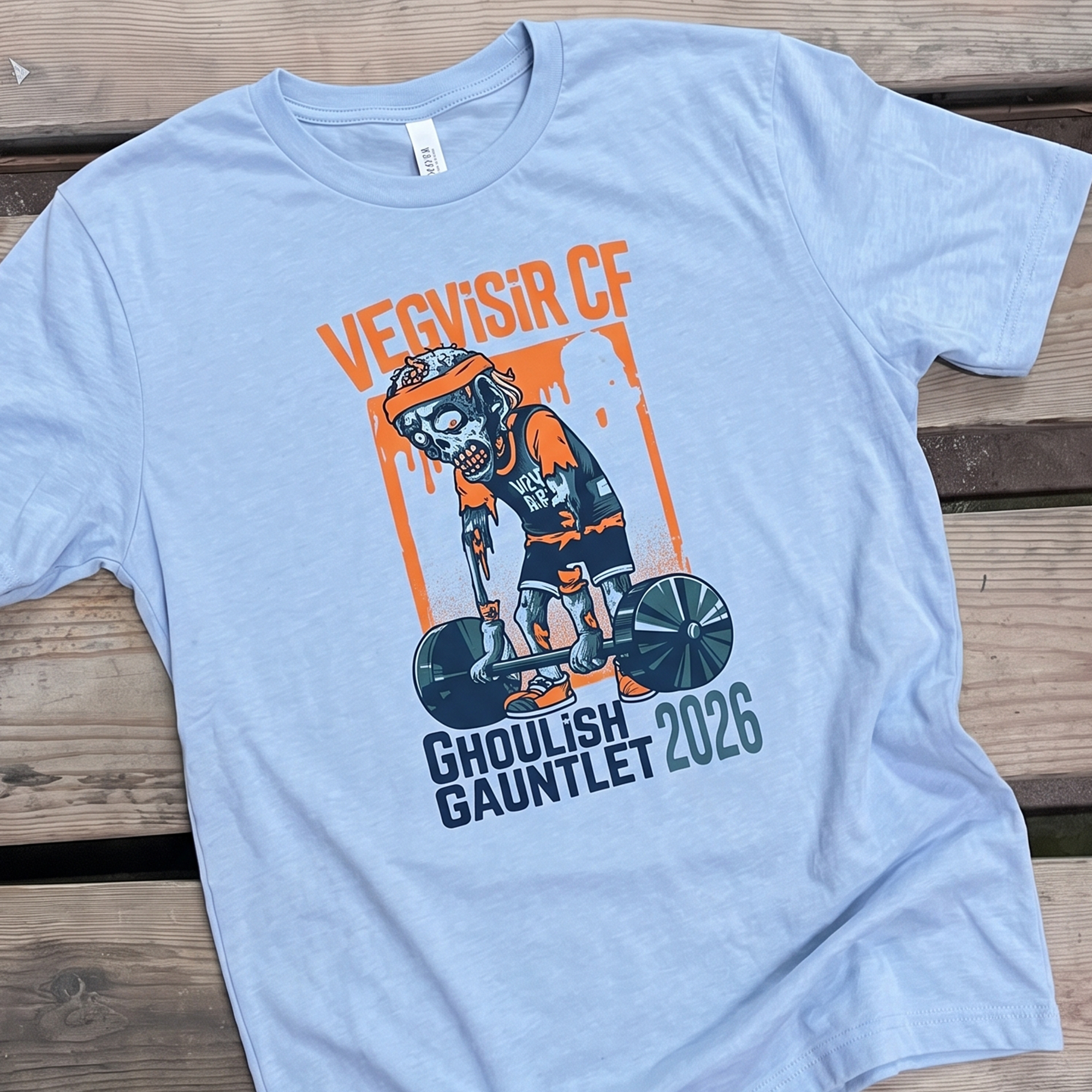 Light blue tee with zombie weightlifter Ghoulish Gauntlet 2026 graphic.