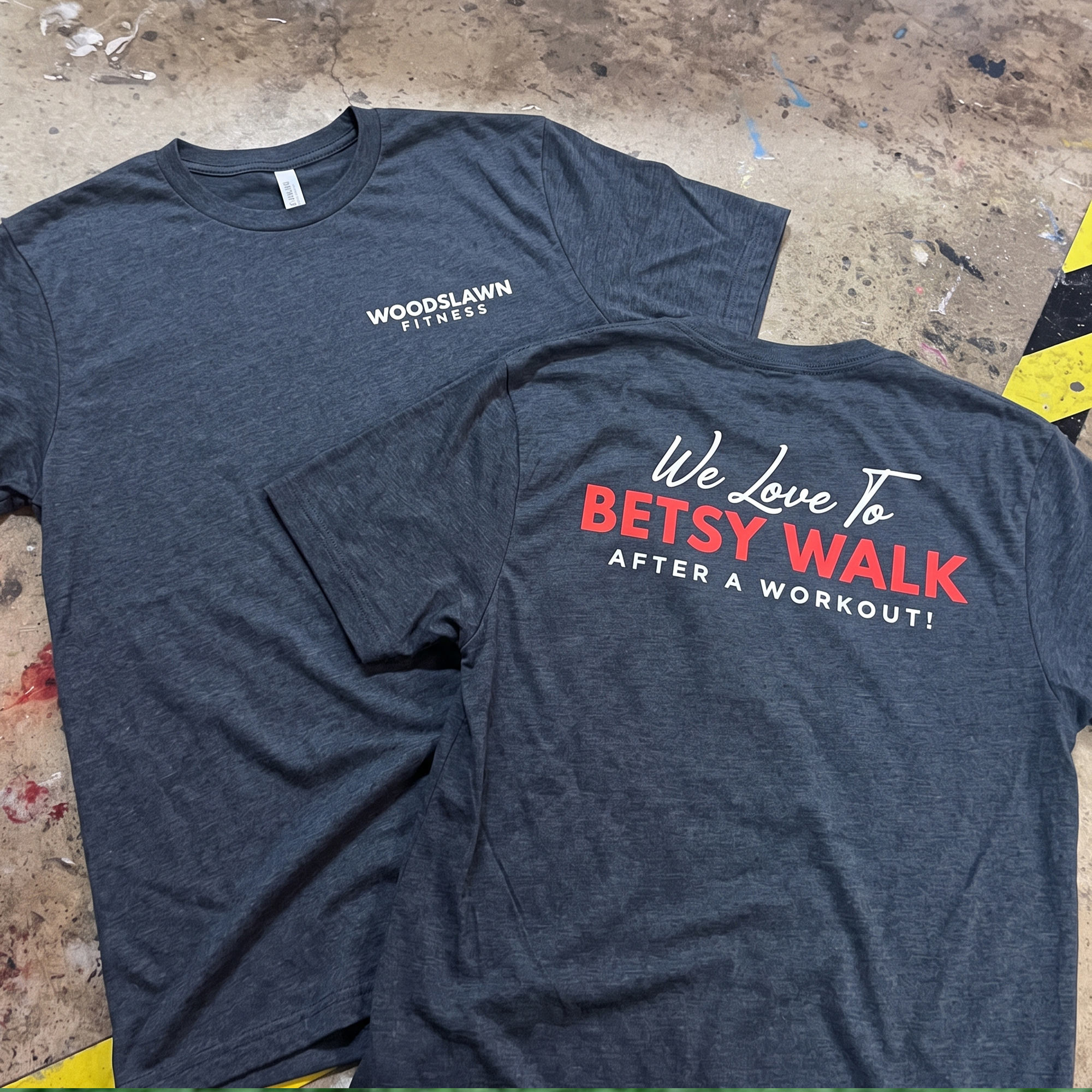 Charcoal Woodslawn Fitness T-shirts with small front logo and red-and-white back slogan print.